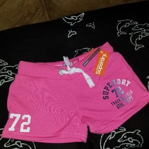 Pink superdry shorts.